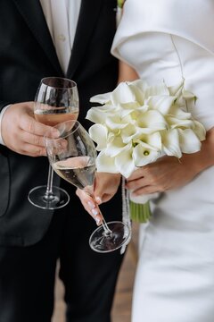 Couple drinking champagne cheering with a glass of wine