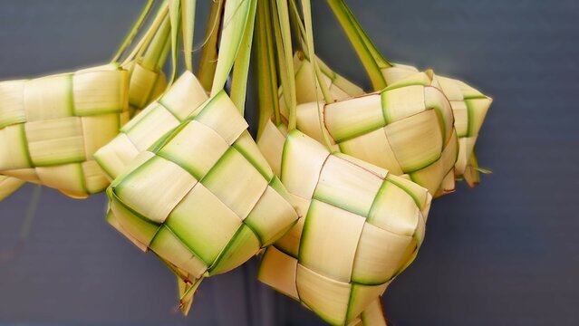 A bundle of palm leaves for making ketupat, a staple in Eid traditions. Ketupat palm leaves.