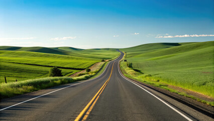 A smooth two-lane highway winding through rolling green fields under a clear blue sky, creating a tranquil, scenic drive with a limitless sense of exploration.