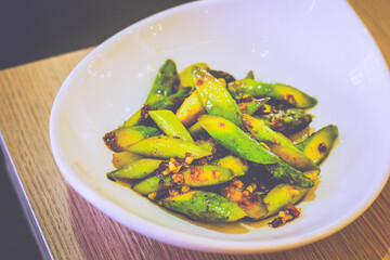 Stir Fried Asparagus With XO Sauce served in a white dish