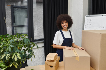 Packing boxes and organizing belongings in a modern living space during a busy moving day