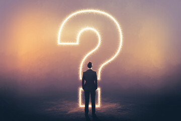 Obraz premium Businessman stands before a large glowing question mark, symbolizing uncertainty, decision-making, or the search for answers in business or life