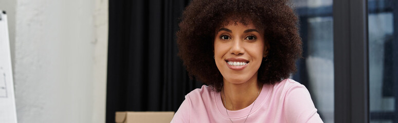 Smiling woman enjoys her time while packing boxes for a new modern home