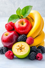 Fruit bounty Apples, bananas, berries, and star fruit arranged against a textured, neutral background