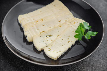 Cheese slices tartiflette soft cheese tasty fresh delicious gourmet food background on the table rustic food top view copy space