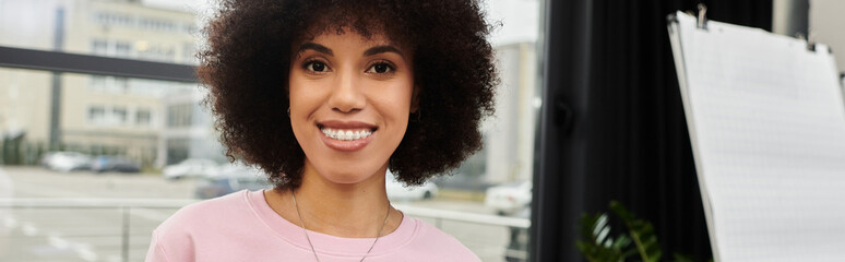 Enthusiastic individual prepares for moving day while packing belongings in a modern space