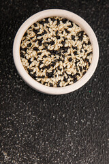 Sesame spice mix white and black tasty fresh gourmet food background on table rustic food top view copy space keto and paleo diet vegetarian and vegan food