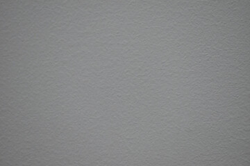 Close up of calm gray textured paper surface. detailed background showing grain and rough material, ideal for design or overlay use