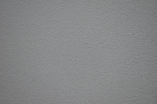 Close up of calm gray textured paper surface. detailed background showing grain and rough material, ideal for design or overlay use