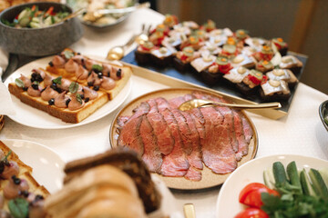 There are many different varieties and types of food present on the table