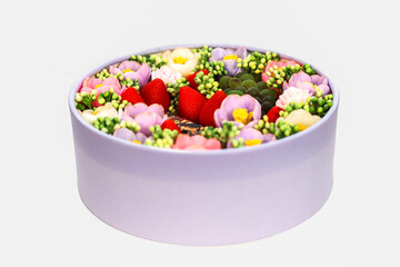 Basket full of flowers and berries made from handmade soap.