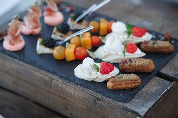 A delicious tray of food is sitting on a beautiful wooden table