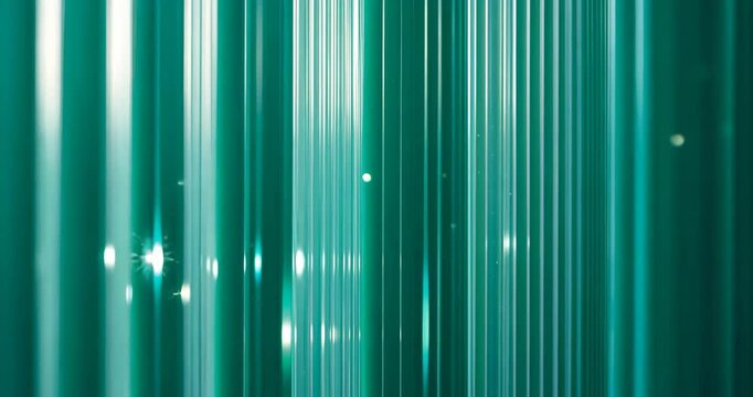Close-up of a green polycarbonate sheet wall illuminated for interior partitioning. Turquoise frosted glass polycarbonate sheet texture. Transparent material referred to as surface.