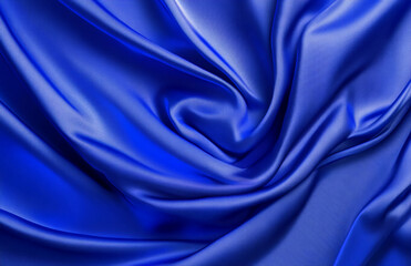 Obraz premium Close up view of a vibrant blue satin fabric with elegant folds and soft light reflections creating depth