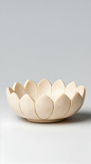 Cream-colored lotus-shaped bowl, intricately carved