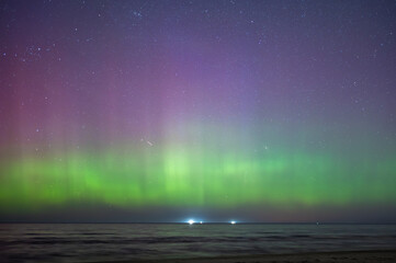 Aurora Borealis northen lights on the Baltic Sea beach in Latvia