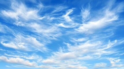 Fototapeta premium A serene sky filled with wispy clouds against a bright blue backdrop, creating a tranquil and picturesque atmosphere.