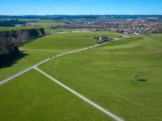 Fototapeta premium aerial spring landscape with wide green meadows in the Western Allgäu near City of Wangen, Baden-Wuerttemberg, Germa