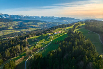 Naklejka premium Aerial landscape photo in early spring in the Bregenz Forest Mountains near Sulzberg, Vorarlberg, Austria 
