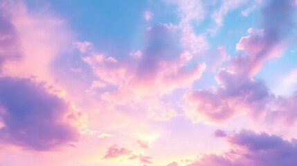 Sky at sunset or dawn with soft clouds and colorful lighting
