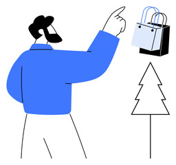 Man in blue shirt points towards shopping bags next to a pine tree. Ideal for eco-friendly shopping, sustainability, consumer behavior, holiday shopping, nature conservation, decision-making