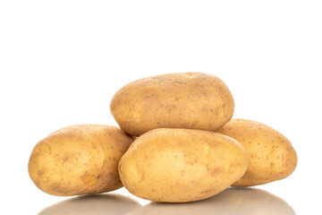 Unpeeled raw potatoes with kitchen utensils isolated on white background, close-up.