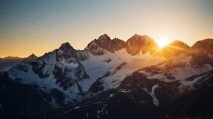 Majestic snow-capped mountains at sunset.