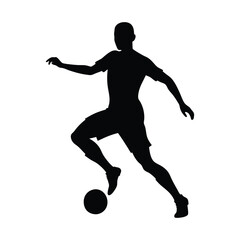 Silhouette of a football player in action running and kicking a ball in a competitive soccer game