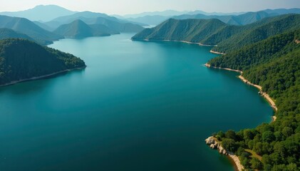 Aerial view, shoreline curves creating geometric shapes on lake, reflection, design, landscape