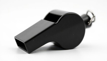 Black plastic whistle, close-up view, pure white backdrop , macro, object