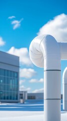 A close-up of a white pipe with a curved joint against a blue sky and modern building, showcasing industrial architecture and design.