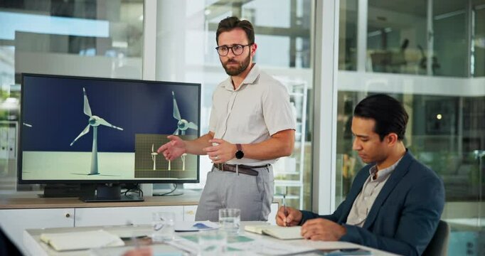 Presentation, meeting and business man with windmill in office for sustainability, innovation and renewable energy. Climate change, power farm and workers with wind turbine for electricity production