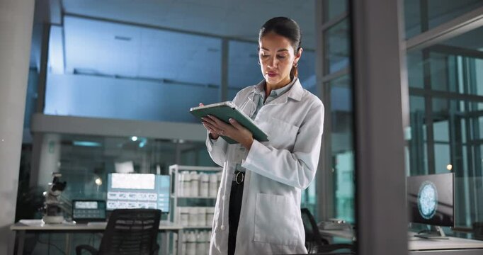 Woman, scientist or interactive display for medical breakthrough, clinical trial or discovery. Night, study and tablet for checking science on technology for vaccine research, cure or dna development