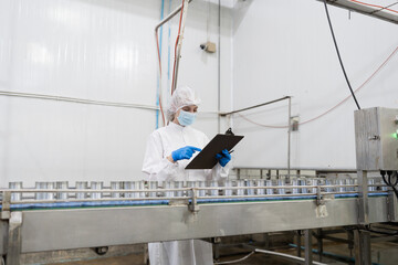Canned fish factory, seafood manufacturing and processing. Food processing. Conveyor belt and...
