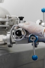 Pharmaceutical factory workers operate the equipment in the modern laboratory of the medicine factory. Sterile machine for medicine manufacture