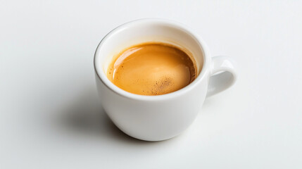 Naklejka premium A freshly brewed espresso shot in a small cup, deep crema on a white background.
