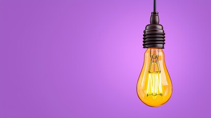 Vintage Light Bulb Hanging Against a Purple Background with Warm Glow