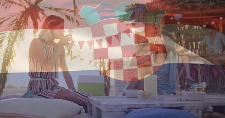 At beach bar, women holding drinks with Croatian flag animation overlaying scene - Powered by Adobe