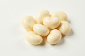 Close-up of several white beans against pure white background, macro photography, white bean, close up