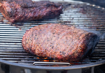 Prime beef picanha steak being cooked on a grill