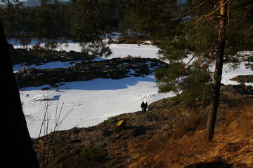 Winter landscape with snow-covered forest and river in the Altai mountains. Manzherok is a rural locality  in  Altai Republic.