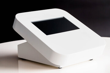 Modern Sleek White Desktop Device with Digital Touchscreen Interface on Reflective Surface