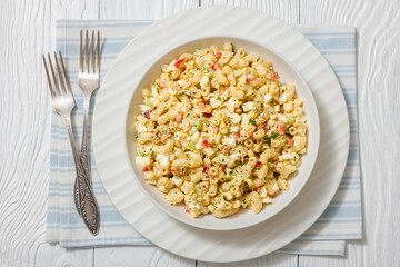 macaroni salad with celery, eggs, red bell pepper