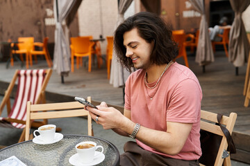 Handsome young man with long hair in cafe