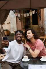 Joyful moments shared between two handsome men on a cozy cafe date enjoying life together