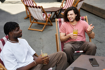 Connection blooms between two handsome men enjoying a sunny date at a charming cafe terrace