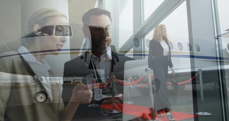 Boarding private jet, business professionals walking on red carpet with airport staff - Powered by Adobe