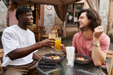 Loving couple enjoys a joyful date at a cozy cafe while sharing delightful moments