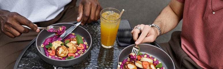Couple enjoys a cozy date at a cafe with delicious food and refreshing drinks together