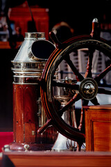 Classic sailing yacht, details of nautical equipment. Elegance of wood and shining metal.